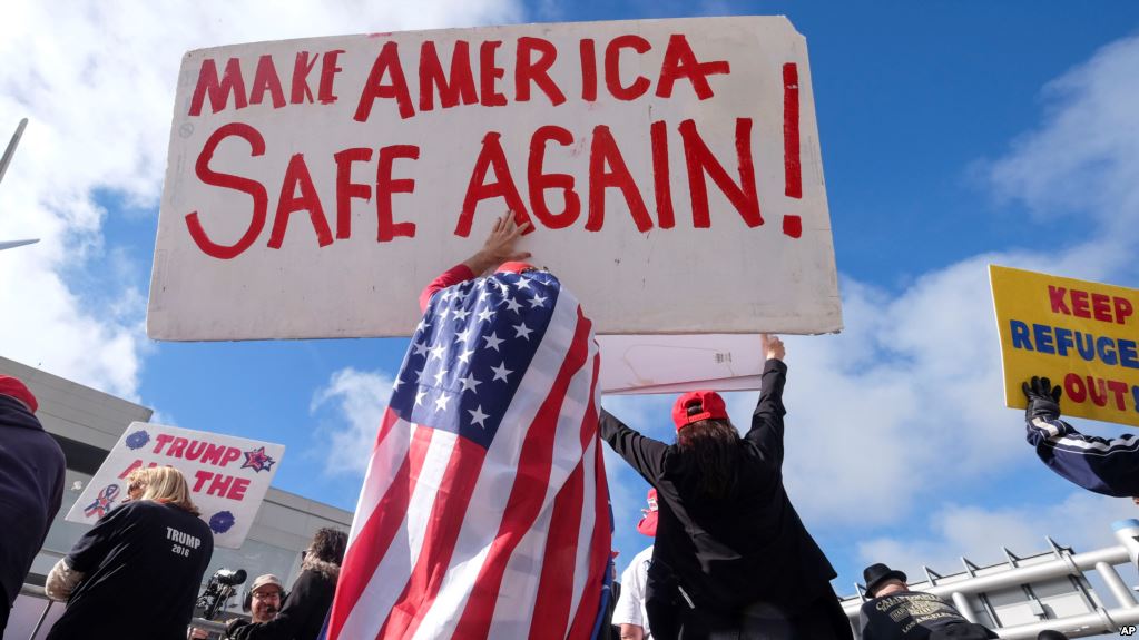 a crowd promoting the idea that foreign-born immigrants make America unsafe