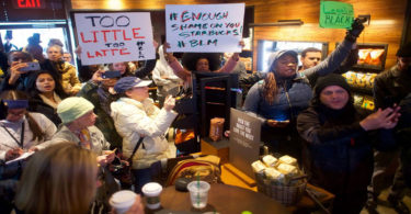 Demonstrators protesting racist behavior in Starbucks